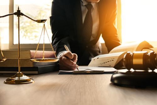 Man in Suit with Legal Scales